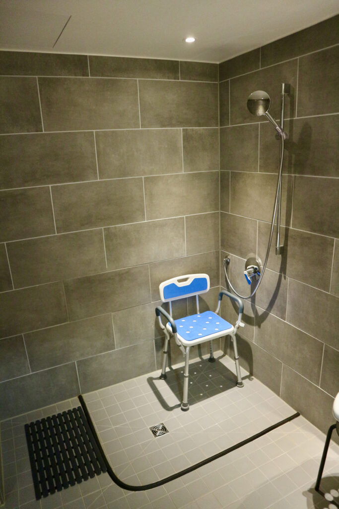 Shower seat and wet room shower