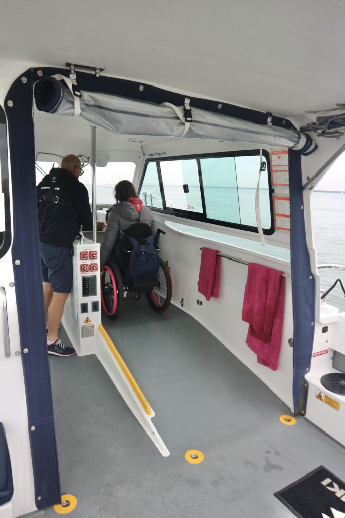 Ramped captain area by steering wheel of adapted boat