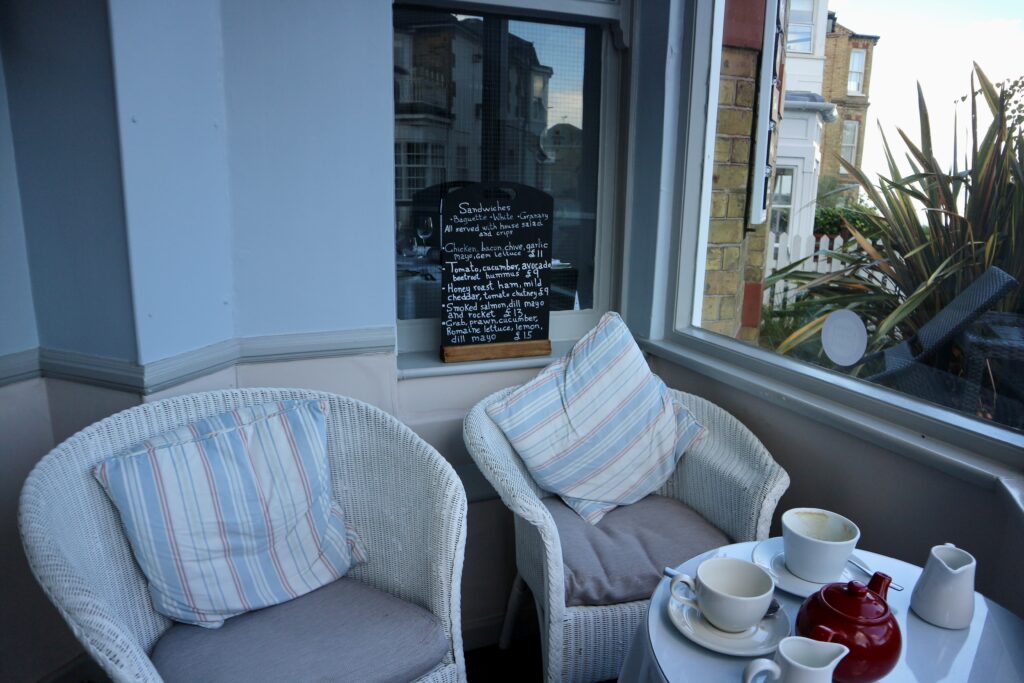 Cosy armchairs with lunchtime menu behind inside the Seaview Hotel