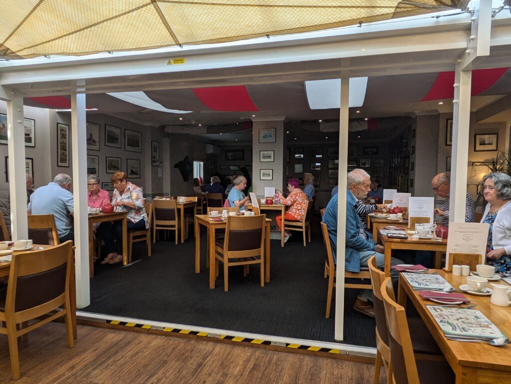 Breakfast dining area, predominantly flat with one small raised step