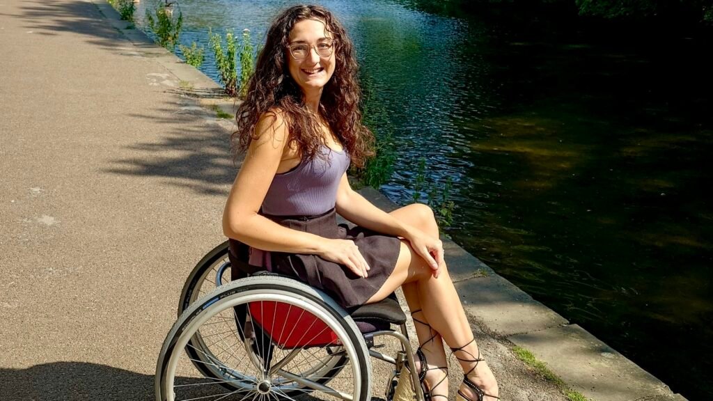 Image of a white brunette female in a manual wheelchair