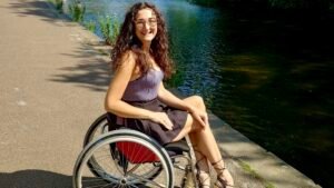 Image of a white brunette female in a manual wheelchair